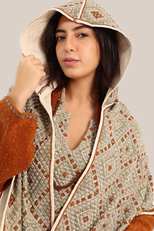 Hooded shawl with pockets and tassels