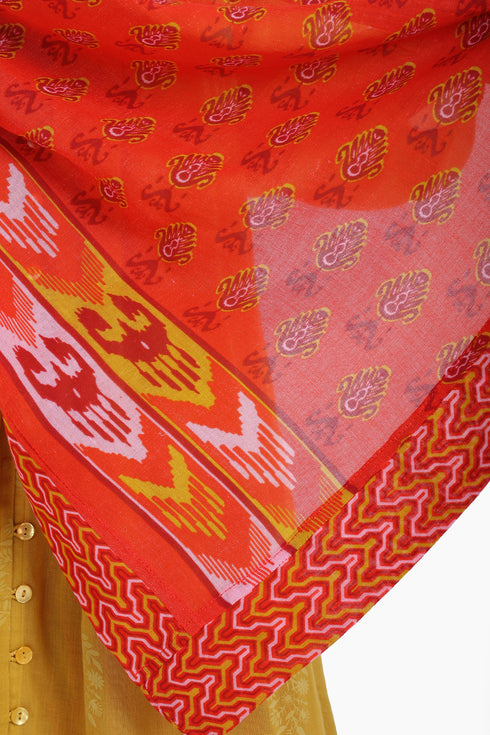 Scarf trimmed in contrast print cotton gauze.