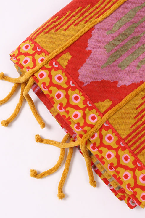 Shawl in patterned jacquard with tassels