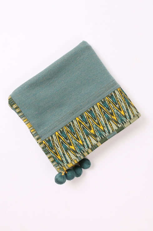 Shawl in plain cotton blend jacquard with pom poms