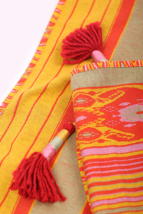 Shawl in striped jacquard cotton with tassels