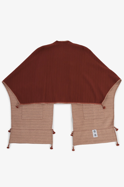 Reversible quilted shawl with pockets and tassels
