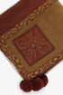 Embroidered jacquard shawl with pompom detailing