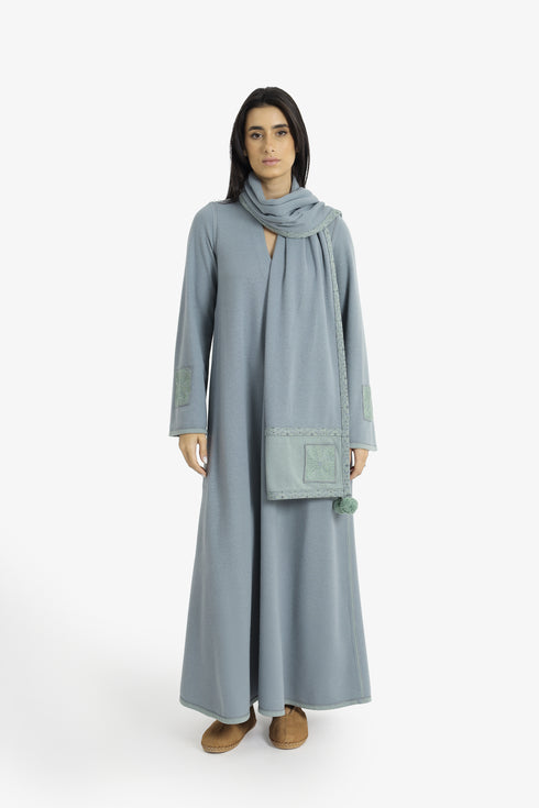 Embroidered jacquard shawl with pompom detailing