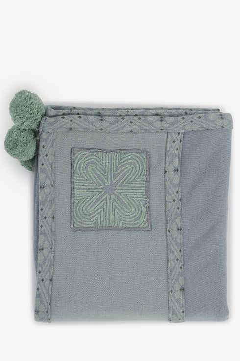 Embroidered jacquard shawl with pompom detailing