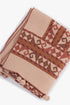 Printed quilted cotton shawl with fabric pompoms