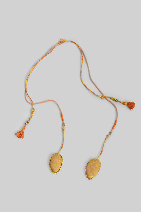 Handmade necklace embellished with beads and buttons