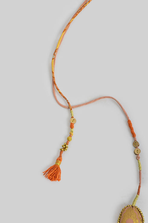 Handmade necklace embellished with beads and buttons