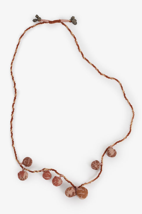 Adjustable fabric ball necklace with metal tassels