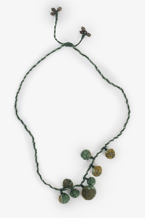 Adjustable fabric ball necklace with metal tassels