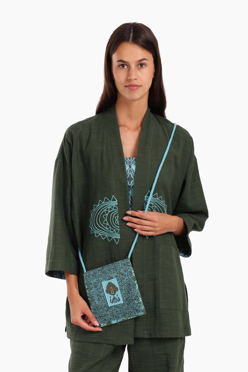 Embroidered small cross body bag in printed cotton