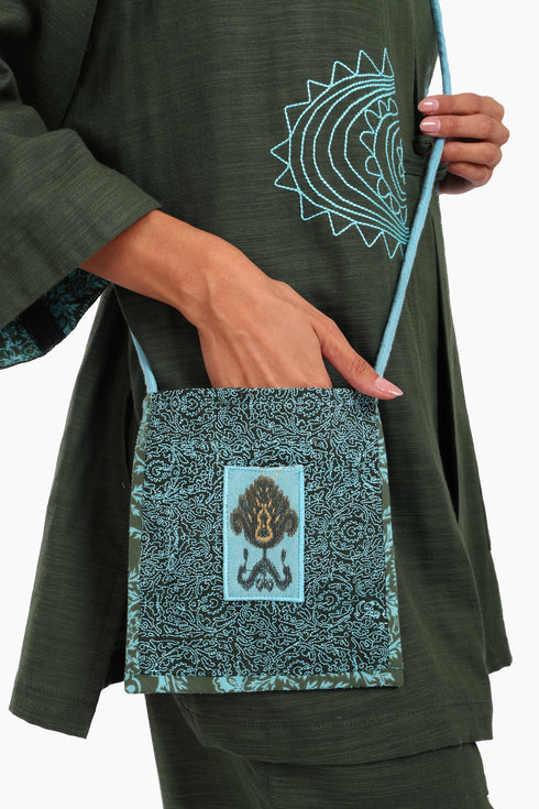 Embroidered small cross body bag in printed cotton