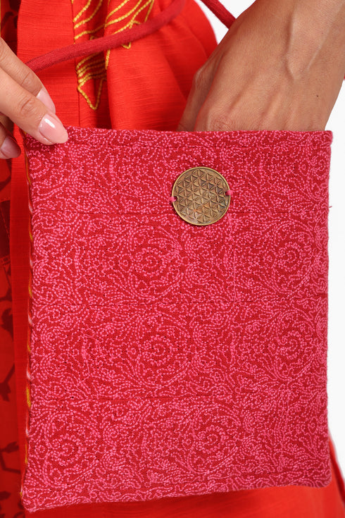 Small cross body bag with embroidered badge