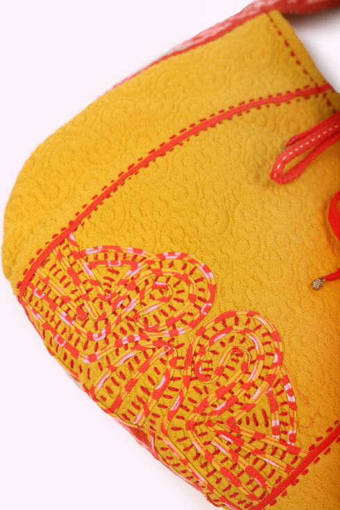 Hand embroidered bag in quilted cotton blend