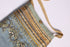 Linen embellished crossbody bag with knit gold strap