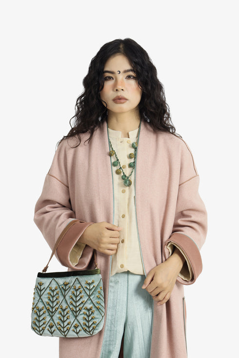 Embroidered velvet bag with genuine leather strap