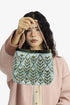 Embroidered velvet bag with genuine leather strap