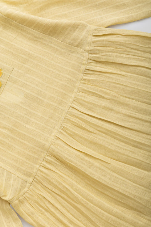 Striped linen top with printed flower on the back