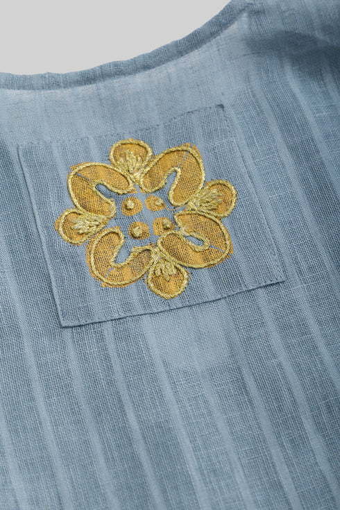 Striped linen top with printed flower on the back