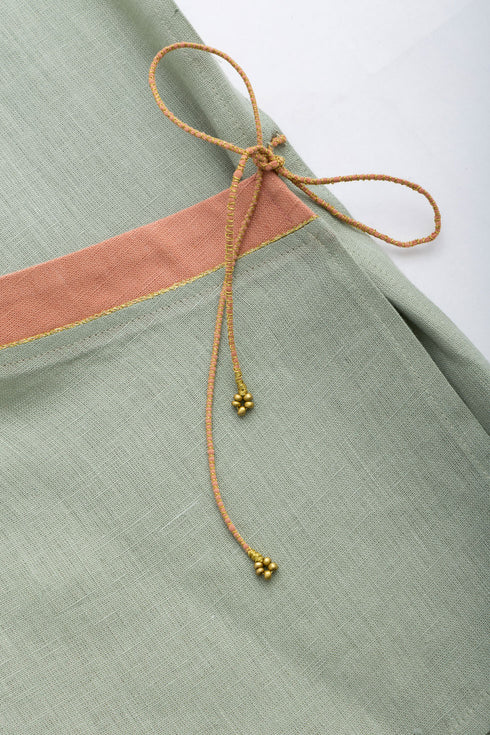 Linen wrap-detail sleeveless top with golden trim