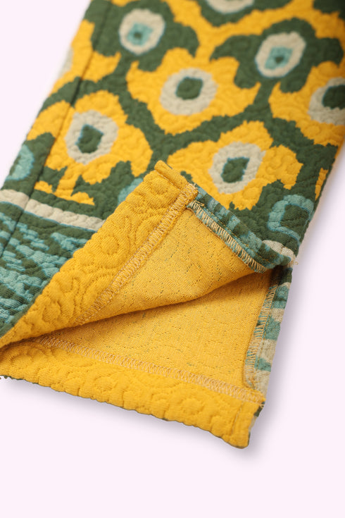 Straight leg pants in quilted printed cotton blend with elastic waist.