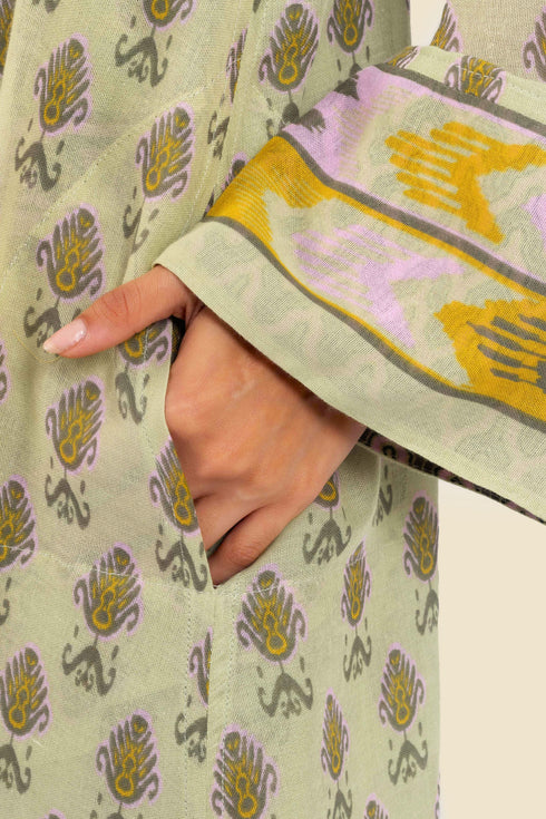 Coat in cotton gauze with asymmetric hemline