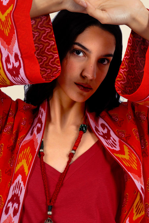 Coat in cotton gauze with asymmetric hemline