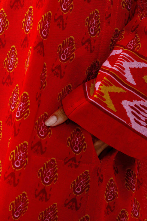 Coat in cotton gauze with asymmetric hemline