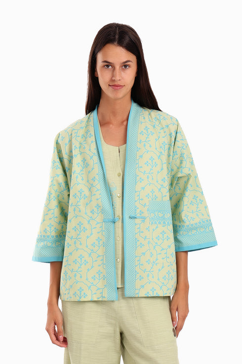 Short jacket in printed cotton with one front button and side slits