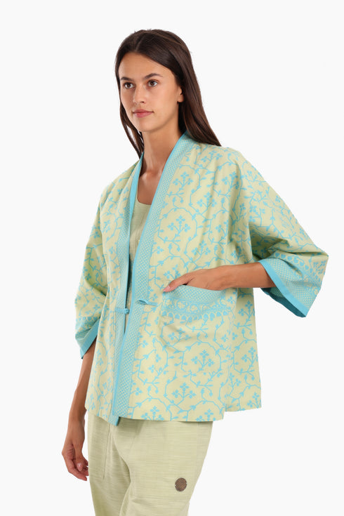 Short jacket in printed cotton with one front button and side slits