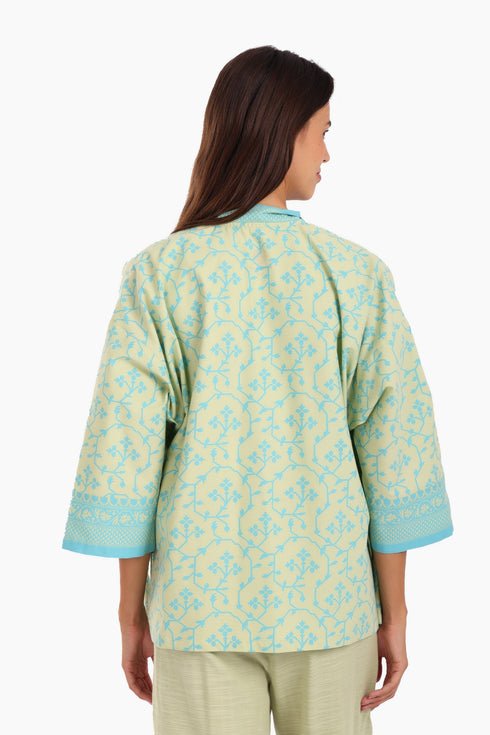 Short jacket in printed cotton with one front button and side slits