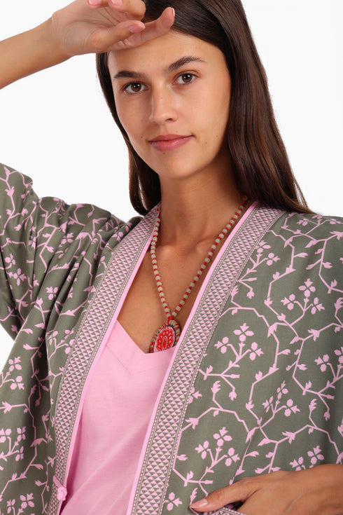 Short jacket in printed cotton with one front button and side slits