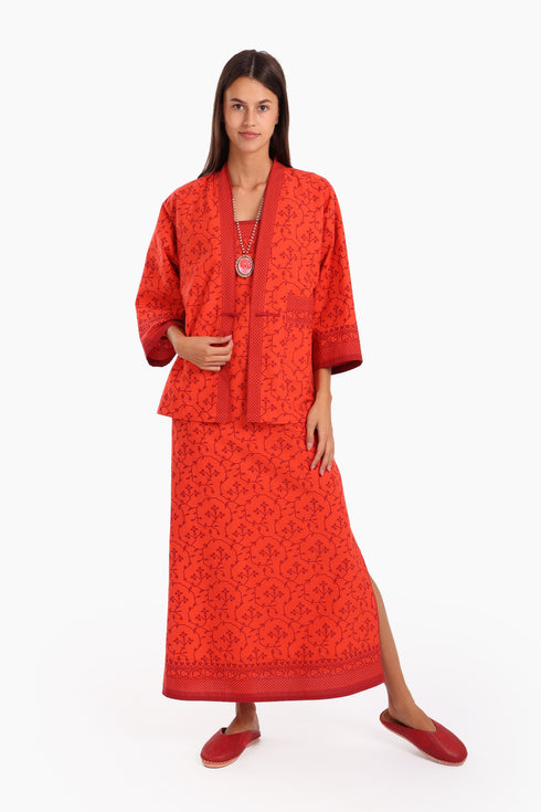 Short jacket in printed cotton with one front button and side slits