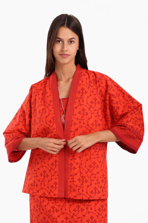 Short jacket in printed cotton with one front button and side slits