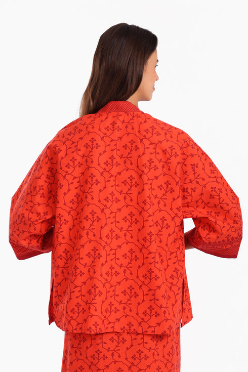 Short jacket in printed cotton with one front button and side slits