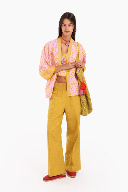 Short jacket in printed cotton with one front button and side slits