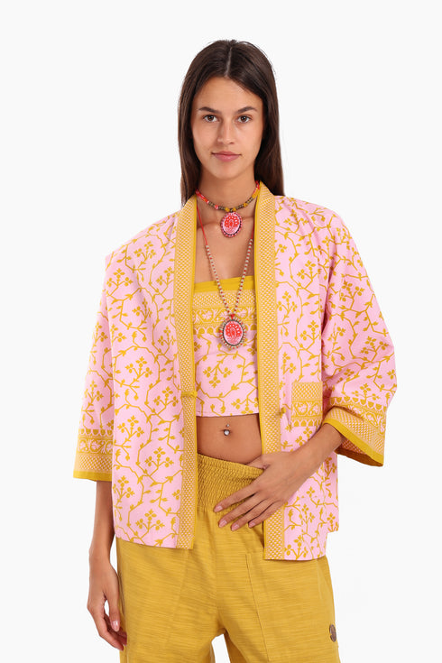 Short jacket in printed cotton with one front button and side slits