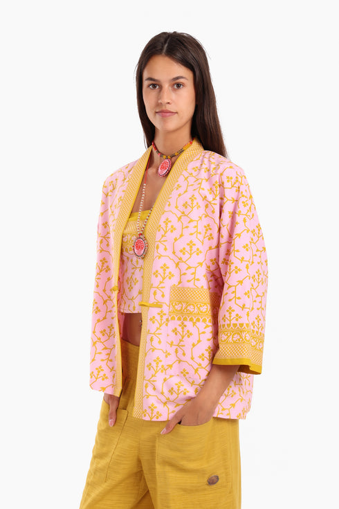 Short jacket in printed cotton with one front button and side slits