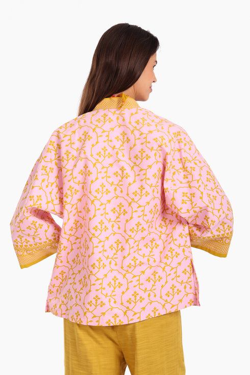 Short jacket in printed cotton with one front button and side slits