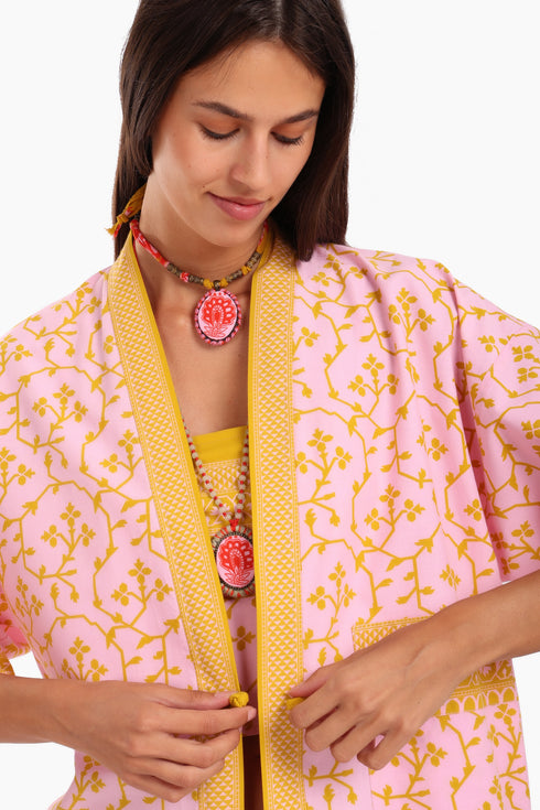 Short jacket in printed cotton with one front button and side slits