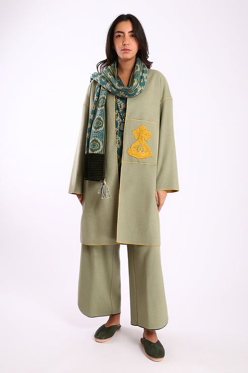 Reversible coat with front embroidered pocket