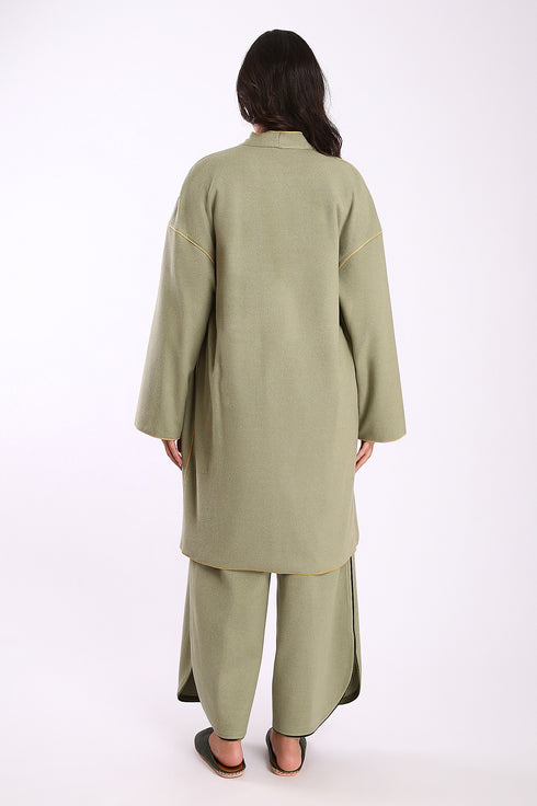 Reversible coat with front embroidered pocket