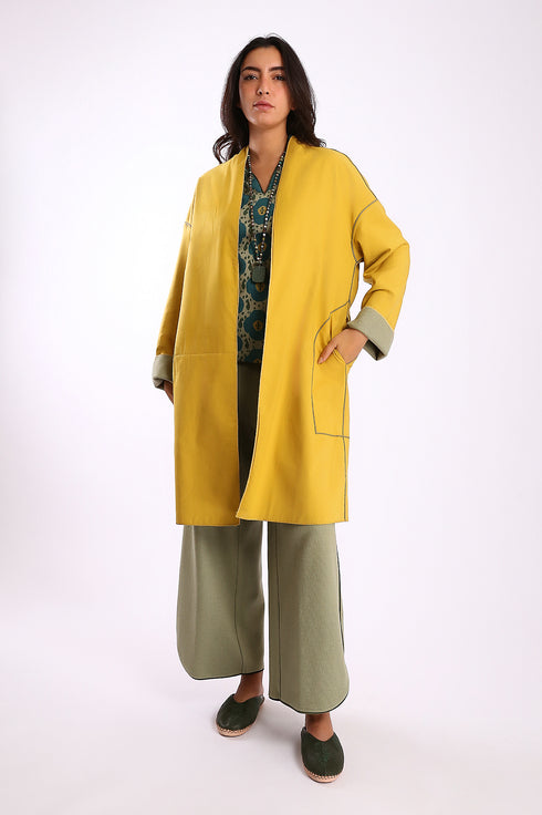 Reversible coat with front embroidered pocket