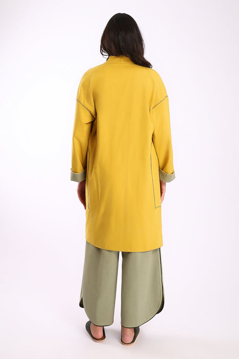 Reversible coat with front embroidered pocket