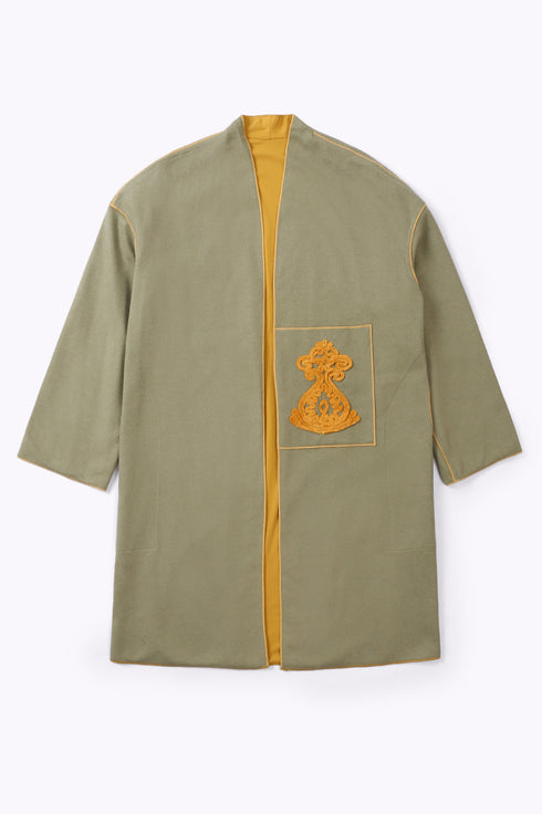 Reversible coat with front embroidered pocket