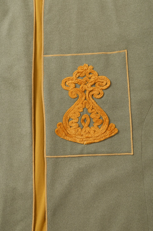 Reversible coat with front embroidered pocket