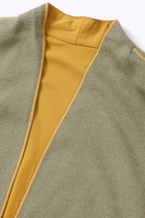 Reversible coat with front embroidered pocket