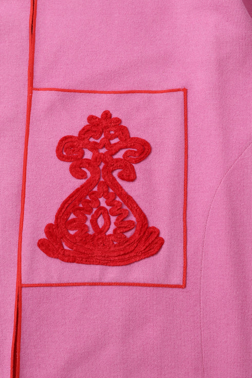 Reversible coat with front embroidered pocket