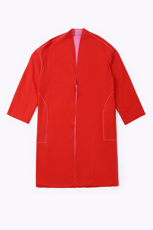 Reversible coat with front embroidered pocket