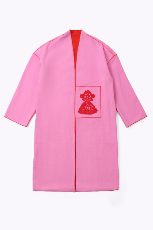 Reversible coat with front embroidered pocket